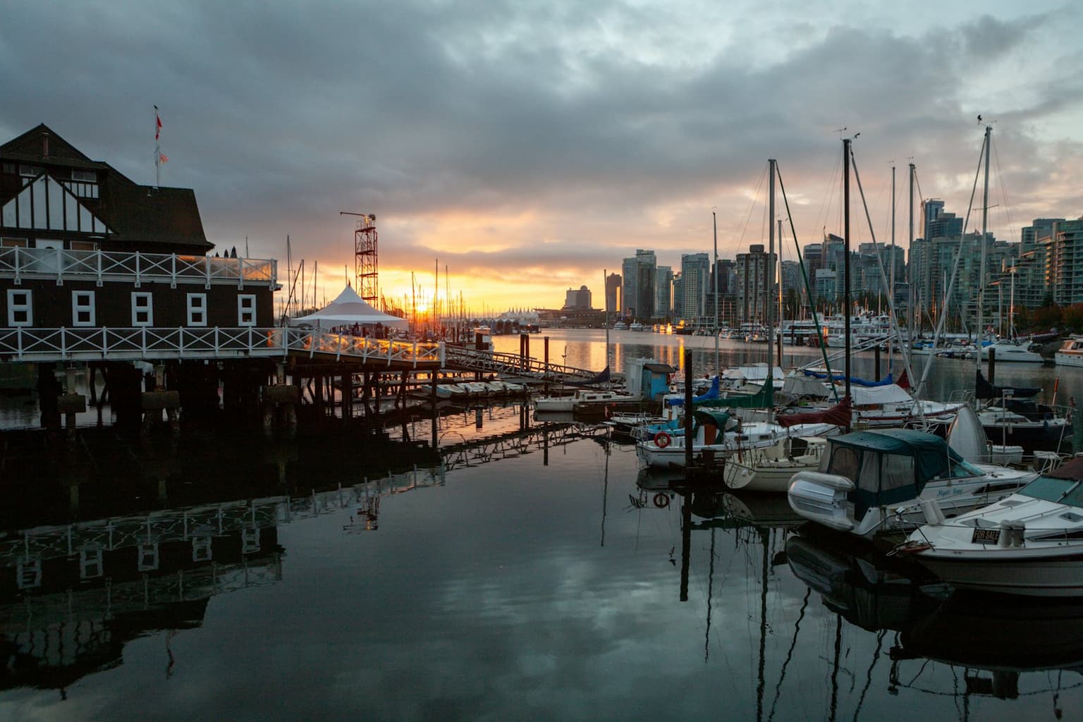 Fishing boats moored in a harbour at dusk